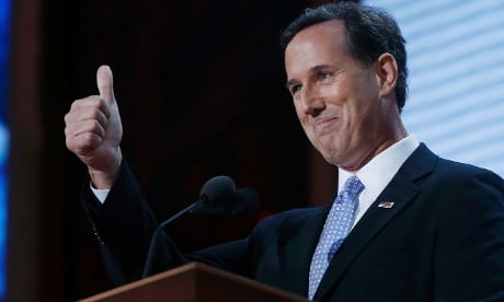 Former presidential candidate Rick Santorum gives a thumbs up gesture as he addresses delegates of the  RNC.
